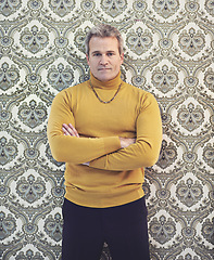 Image showing Man, portrait and confident with vintage fashion for 70s, old school and clothes for unique style. Male person, mature and retro outfit with arms crossed, classic look and antique trendy wallpaper