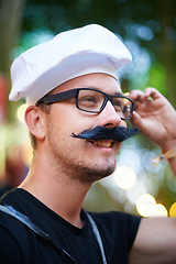 Image showing Man, fake moustache and smile at carnival with costume for entertainment, celebration and party in France. Outdoor event, festival and fun for summer holiday to relax, music and enjoy vacation.
