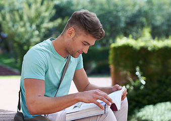 Image showing Student, man and reading with books at park, campus or university for studying, development or knowledge. Person, college and outdoor in garden with thinking, information or scholarship for education