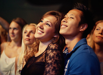 Image showing Music, night and crowd with couple at concert for band, happiness and festival date together. Fans, support and social with group of people at musician event for audience, performance and song