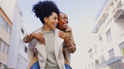 Image showing Friends, women and happy with piggyback outdoor in city for travel, adventure or bonding in town together. Laugh, smile and people excited with back ride, playful or having fun on vacation or holiday