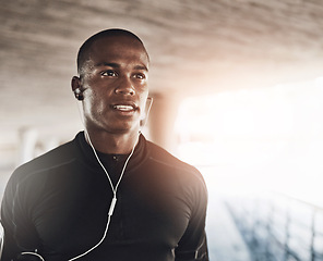 Image showing Man, face and music for fitness outdoor with thinking, listening to podcast and exercise for healthy body. Athlete, african person and earphones with audio, radio and sound for workout and training