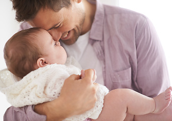 Image showing Baby, girl and dad holding with smile, proud and fathers day in family home. Parents, infant and love embrace for eskimo kiss, growth and healthy child development in nursery for affection parenting