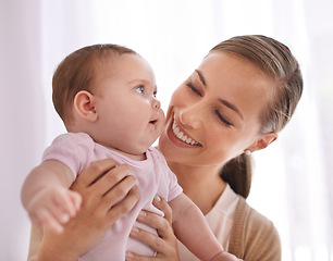 Image showing Happy, baby and mom in a home with a calm, relax and sweet infant in a living room. Youth, child and house with toddler in the morning with love, smile and care from parent with support and bonding