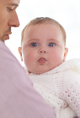 Image showing Happy, baby and parent in a home with a calm, relax and sweet infant in a living room. Youth, child and dad with toddler clothing in the morning with joy and father with support, love and bonding