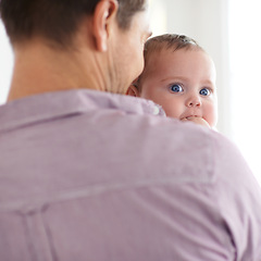 Image showing Family, baby and face with dad in home with love, support and care together with parent and bonding. Relax, father and happy in a house with hug of calm infant with childcare and thinking with youth