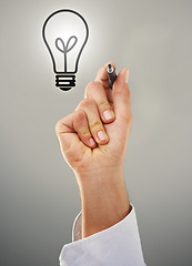 Image showing Hand, light bulb and drawing with ideas for business growth and development on grey background. Person brainstorming, corporate innovation and knowledge for enlightenment, inspiration and insights