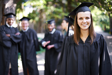 Image showing Student, portrait and graduation with woman outdoor at university, college and achievement ceremony. Education, campus and class at certificate, degree and school event with a smile from diploma