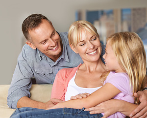 Image showing Relationship, child or parents on couch with love, relax or bonding together for peace on weekend. Father, mother and daughter for happy family with care, vacation and excited with hugging in lounge