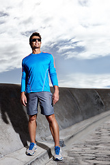 Image showing Man, road and ready for run in outdoors, confident and athlete for performance training. Happy male person, full body and sunglasses for workout on street, cardio and prepare for exercise or fitness