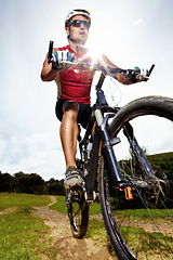 Image showing Nature, cycling and man athlete with bicycle in park for marathon, race or competition training. Fitness, sports and male cyclist riding bike for cardio workout or exercise in outdoor forest.