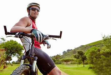 Image showing Fitness, break and man cycling in countryside for training, cardio or adventure on off road path. Exercise, sports and bike with cyclist person resting in nature for health, workout or challenge