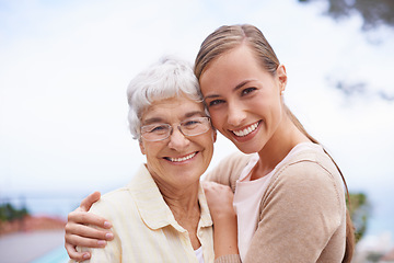 Image showing Hug, family and portrait of senior mother with daughter embrace for bonding, relationship and love. Happy, retirement and face of elderly parent with woman for care, affection and relaxing outdoors