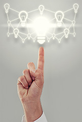 Image showing Hand, light bulb and digital transformation for business growth and development on grey background. Person with networking ideas, corporate innovation and knowledge with enlightenment and inspiration