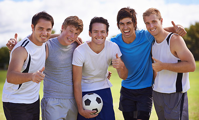 Image showing Soccer, men and thumbs up in portrait in team at game for fitness, exercise or happy in nature. People, field and embrace with hand sign for agreement, winning or football with friends in competition