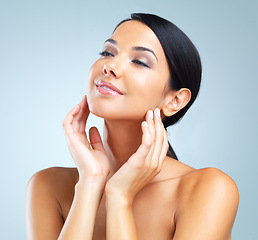 Image showing Cosmetics, glow and woman with skincare, dermatology and wellness on a grey studio background. Person, model and girl with treatment and healthy skin with grooming and shine with aesthetic and makeup