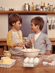 Image showing Boys, baking and together in kitchen with flour, home and bonding with ingredients for dessert cake. Children, mixing and bowl for cookies on counter, eggs and learning of pastry recipe with butter