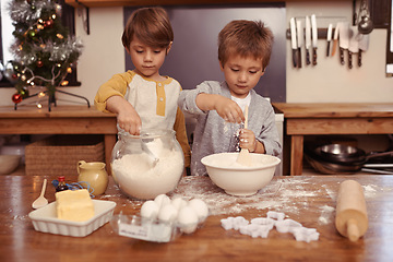 Image showing Kids, baking and playing in home with flour, love and bonding with ingredients for dessert cake. Boys, mixing or bowl for christmas cookies on counter, eggs or learning of pastry recipe by cutter