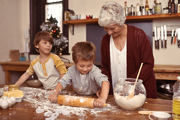 Image showing Grandmother, smile and kids baking in kitchen, learning or happy boys bonding together in home. Grandma, children and cooking with flour, rolling pin or messy brothers having fun with family at table