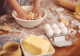 Image showing Children, baking and hands in kitchen with dough, home and learning with ingredients for dessert cake. Kids, kneading and playing with flour on table, love and eggs for butter biscuits on holiday