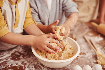 Image showing Kids, baking and hands in kitchen with dough, home and learning with ingredients for dessert cake. Children, kneading and playing with flour on table, love and pastry recipe for biscuits on holiday