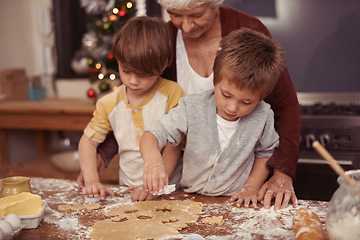 Image showing Learning, grandma and children in kitchen baking dessert or pastry. Education, kids and grandmother with cookie dough on table for quality time together in house or holiday, vacation and celebration.