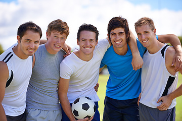 Image showing Soccer, men and hug in portrait on field at game with fitness, exercise and happy in nature. People, teamwork and embrace with pride for support, solidarity or football with friends in competition