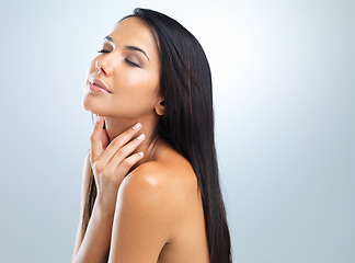 Image showing Wellness, shine and woman with dermatology, beauty and glow on grey studio background. Person, model and girl with skincare or healthy skin with cosmetics, facial or mockup space with self care