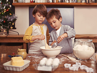 Image showing Boys, baking and playing in home with flour, love and bonding with ingredients for dessert cake. Children, mixing or bowl for christmas cookies on counter, eggs or learning of pastry recipe by cutter