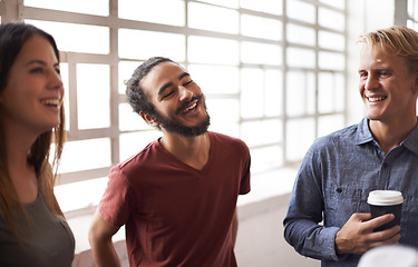 Image showing Diverse, university students and chatting in hallway, laughing and socialising on campus. Laugh, smile and happy between classes, education and conversation with group of friends bonding or talking