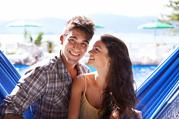 Image showing Couple, hammock relax at holiday resort for summer vacation in Hawaii for honeymoon, bonding or love. Man, woman and lodge pool at tropical paradise or hotel for resting, travel or beach break