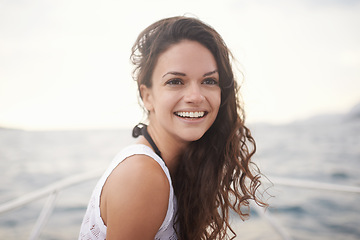 Image showing Woman, sea and smile on yacht in outdoors, calm and travel to ocean on summer holiday. Happy female person, cruise and relax on boat transportation in water, peace and sailing in Italy on vacation