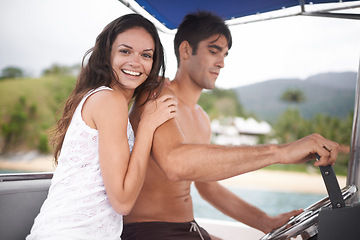 Image showing Couple, boat and driving for lake holiday or explore sea on vacation adventure or sailing, travel or steering wheel. Man, woman and happy in Hawaii or outdoor journey on coast, transportation or trip