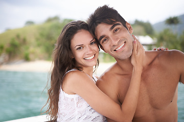 Image showing Portrait, smile and couple at ocean on holiday, vacation or travel together outdoor in Italy. Face, man and happy woman at sea for adventure, care and connection in summer by water in nature for love