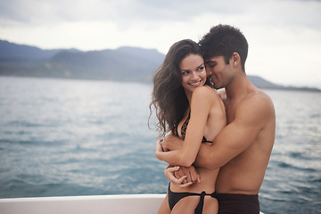 Image showing Couple, yacht and embrace on ocean on vacation, love and relax by water on summer holiday. People, cruise and bonding for relationship in outdoors, support and hug on sea adventure on boat or travel