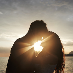 Image showing Silhouette, couple and face at ocean for sunset, vacation or travel together in summer on lens flare. Man, woman and romance at sea with shadow for connection, love and adventure by water outdoor