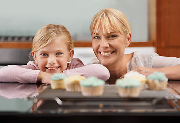 Image showing Kitchen, cupcake and portrait with child and mom baking to relax in home together on holiday. Family, bonding and kid smile with mother, excited for eating cake, sweets or enjoy food in house