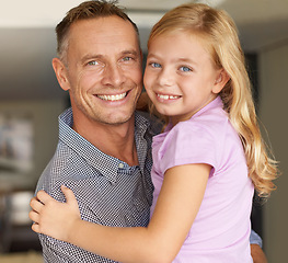 Image showing Portrait, father and daughter in home with love, embrace and parent care on weekend in living room. Dad, child and smile on face of happy family, support and bonding together on vacation in house