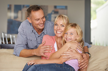 Image showing Portrait, child or parents on couch with love, relax or bonding together for peace on weekend. Father, mother and daughter for happy family with care, vacation and excited face for hugging in lounge