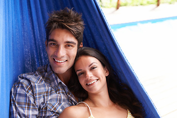Image showing Couple, portrait and hammock relax on holiday for summer vacation in Hawaii for honeymoon, bonding or stress relief. Man, woman and peaceful at tropical paradise resort for resting, travel or calm