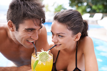 Image showing Swimming pool, cocktail and couple with vacation, summer and weekend break with happiness and honeymoon. Sunshine, man and woman with tropical drink and wet with holiday and luxury with water and joy