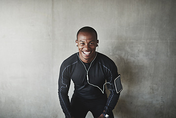 Image showing Man, portrait and earphones for fitness outdoor with listening, podcast or exercise for healthy body with mockup. Athlete, african person or arm pouch with phone for music, radio or happy for workout