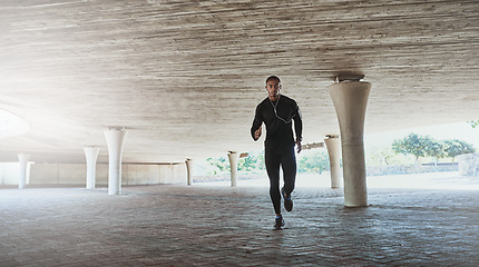 Image showing Man, face and running for fitness outdoor with music, listening to podcast and exercise for healthy body. Athlete, person and earphones with audio, radio and sound for marathon training in car park