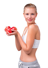 Image showing Happy, portrait and woman with apple for nutrition benefits in diet on white background in studio. Girl, smile and eating fruit for detox of digestion and food with vitamin C and fiber for gut health