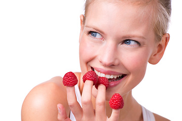 Image showing Happy, playful and woman eating raspberries, fingers and wellness isolated on white studio background. Person, mockup space or model with fruit and funny with nutrition, fresh or cheerful with health