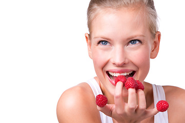 Image showing Healthy, playful and woman eating raspberries, fingers and wellness isolated on white studio background. Person, mockup space or model with fruit and funny with nutrition, fresh or happiness with joy