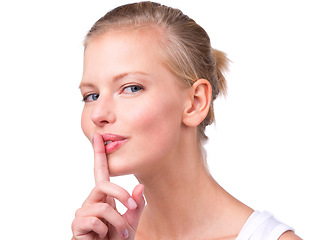 Image showing Woman, portrait and finger with secret in studio for noise, privacy and whisper for confidential mystery. Model, person and face with shush gesture for silence, gossip or surprise on white background