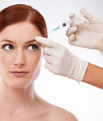 Image showing Woman, hands and filler injection forehead or wrinkles as anti aging skincare procedure, dermatology or plastic surgery. Female person, fingers or syringe needle as studio, mockup or white background
