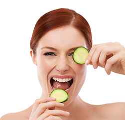 Image showing Portrait, skincare and woman with cucumber in studio with white background, eye and vegetable for facial. Female person, nutrition and organic for healthy diet, girl and food or natural treatment
