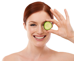 Image showing Portrait, skincare and woman with cucumber in studio for beauty, shine or collagen benefit on white background. Face, cosmetics and hand with green fruit for dermatology, vitamin c and organic facial